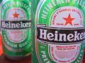 background: Two cans of Heineken.