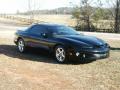 background: 1999 Pontiac Firebird