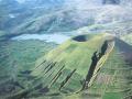background: Green volcano